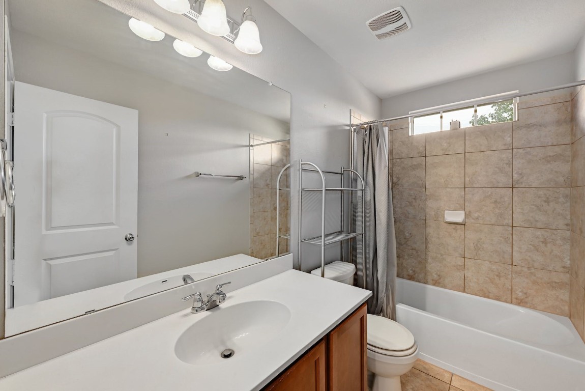 10104 Wading Pool Path Austin, TX 78748 - Photo 18 of 25 a bathroom with a sink a toilet and shower