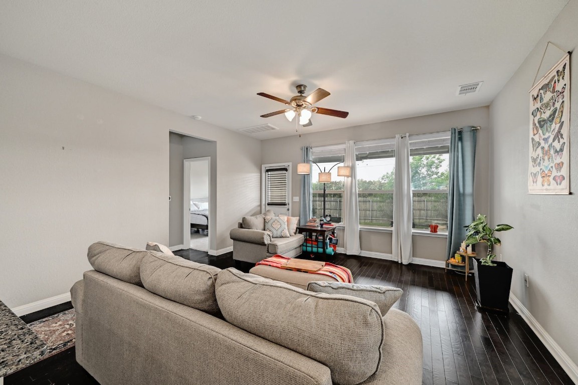 10104 Wading Pool Path Austin, TX 78748 - Photo 22 of 25 a living room with furniture and a large window with wooden floor