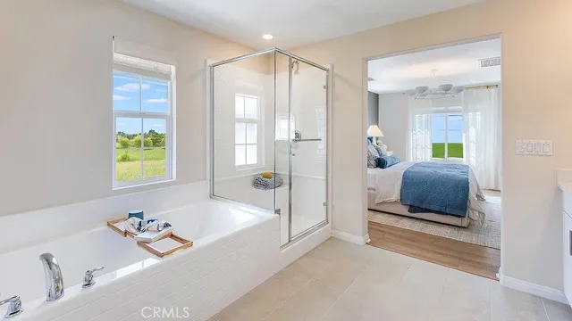 a bathroom with a tub a sink and a bathtub