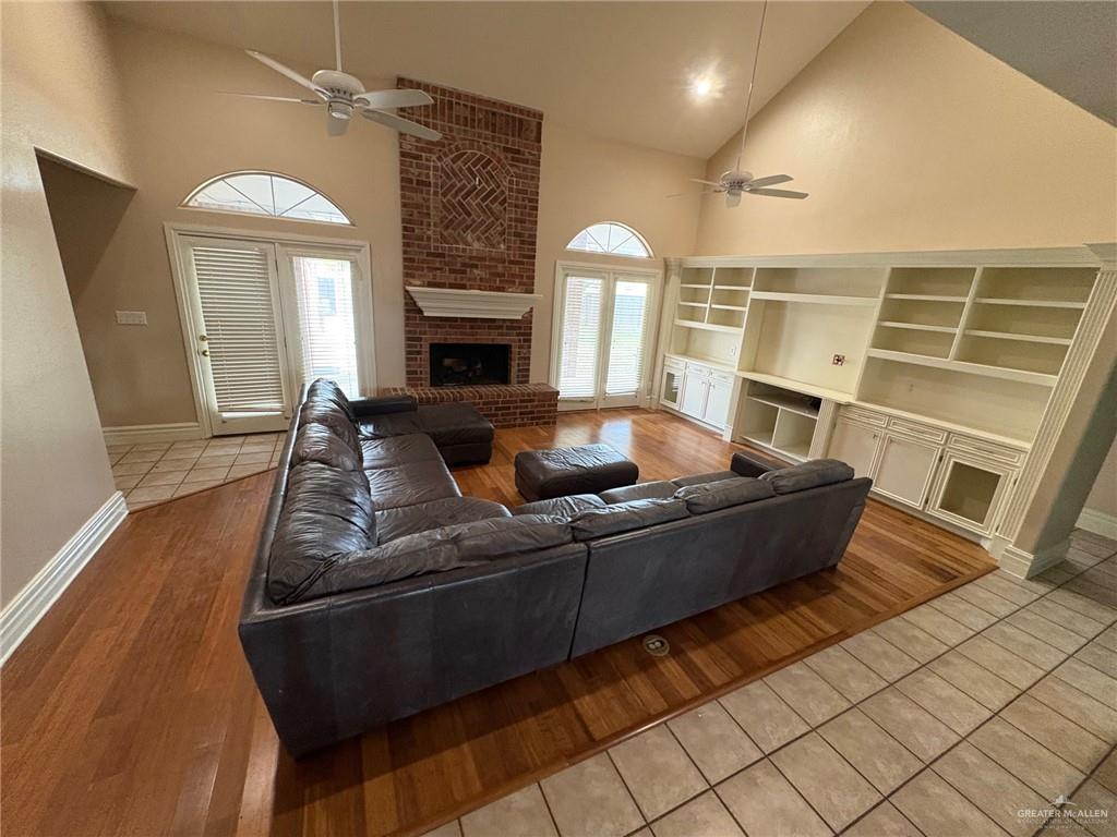 336 Toucan Avenue McAllen, TX 78504 - Photo 12 of 34 a living room with furniture and a fireplace