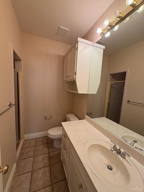 336 Toucan Avenue McAllen, TX 78504 - Photo 23 of 34 a bathroom with a sink a toilet and mirror