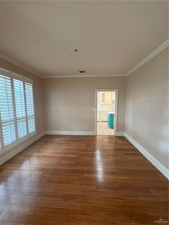 336 Toucan Avenue McAllen, TX 78504 - Photo 4 of 34 a view of empty room with wooden floor and fan