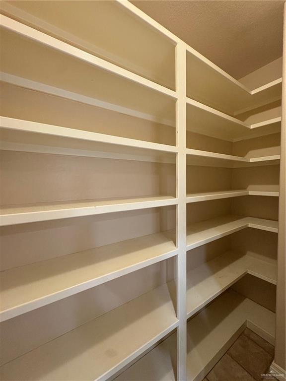 336 Toucan Avenue McAllen, TX 78504 - Photo 9 of 34 a view of walk in closet with empty racks