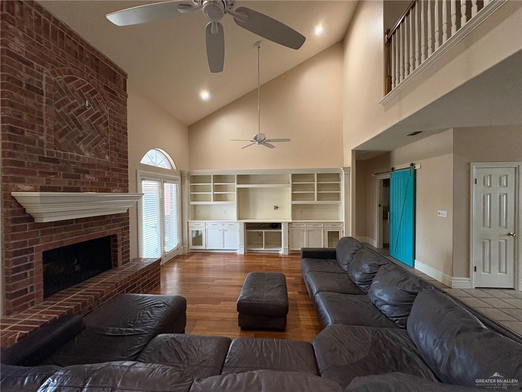 336 Toucan Avenue McAllen, TX 78504 - Photo 10 of 34 a living room with furniture and a fireplace