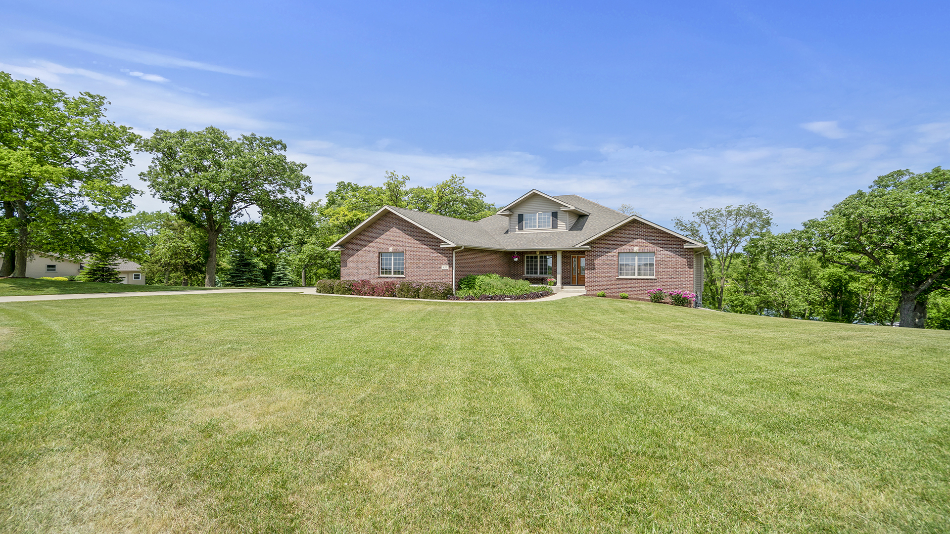 853 Hillside Drive Byron, IL 61010 - Photo 1 of 46 a front view of a house with garden