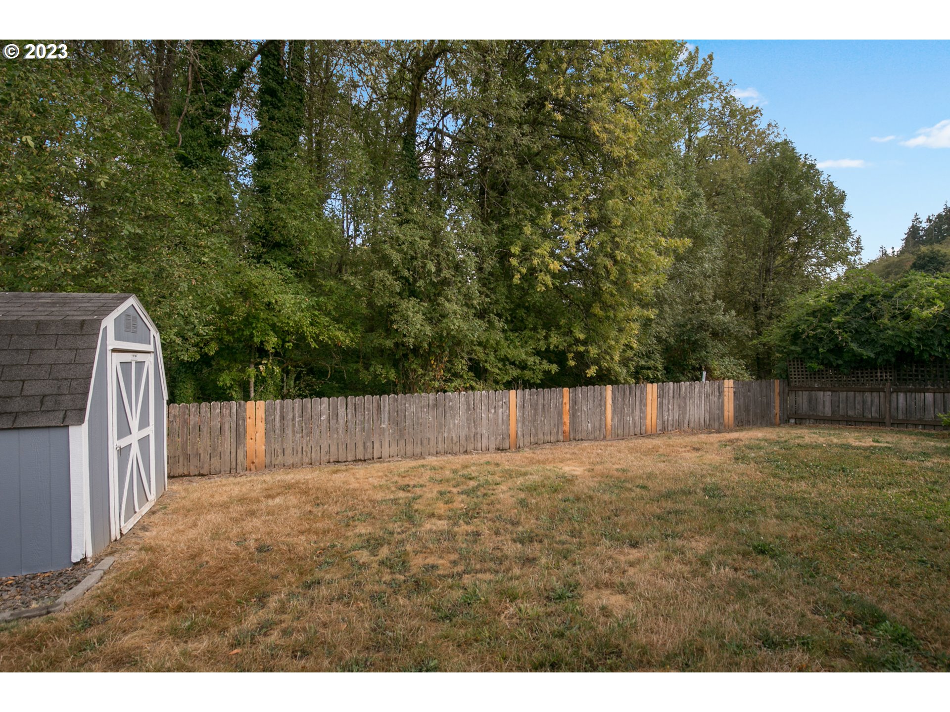 18 South Gee Creek Loop Ridgefield, WA 98642 - Photo 18 of 24 a view of backyard with wooden fence