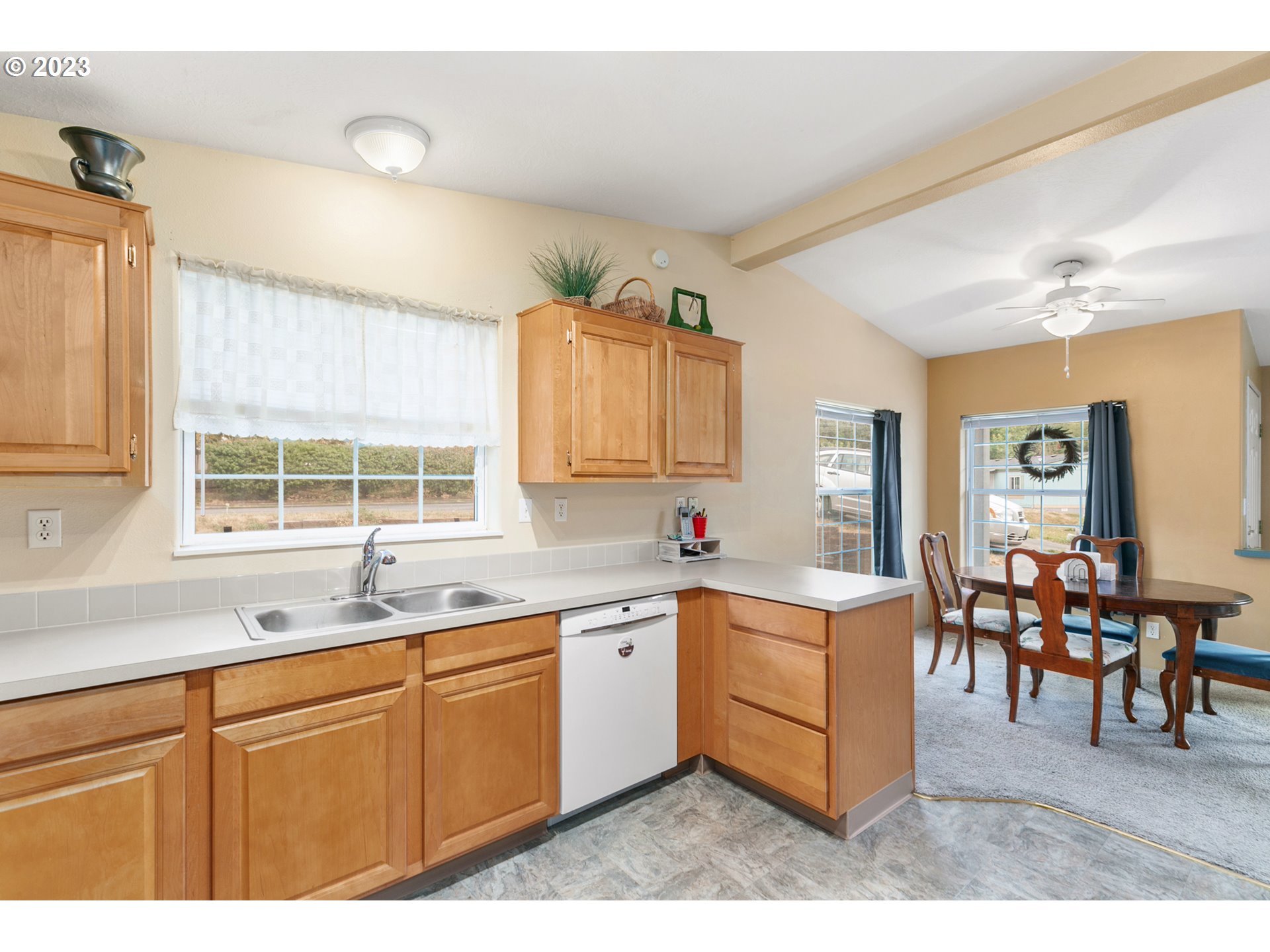 18 South Gee Creek Loop Ridgefield, WA 98642 - Photo 5 of 24 a kitchen with a sink and cabinets