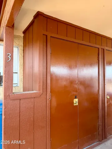 a bathroom with a toilet and a shower curtain