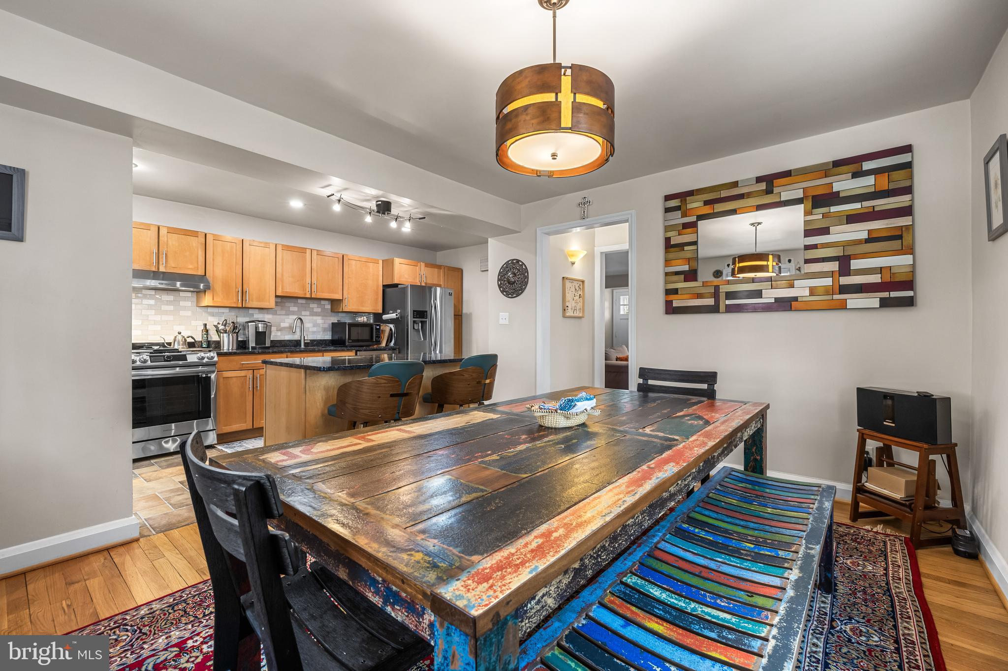 6447 Blenheim Road Baltimore, MD 21212 - Photo 20 of 51 a kitchen with stainless steel appliances granite countertop a stove a sink and a microwave