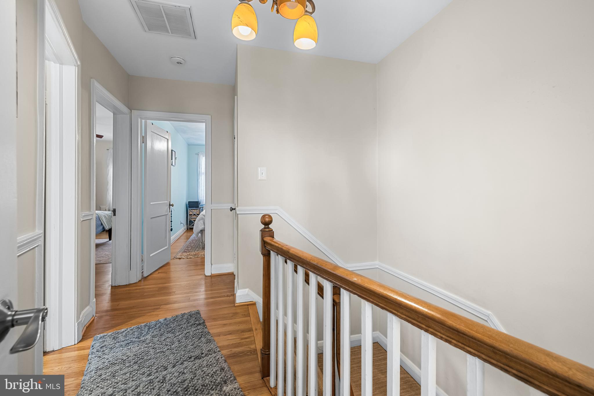 6447 Blenheim Road Baltimore, MD 21212 - Photo 24 of 51 a view of a hallway with wooden floor and staircase