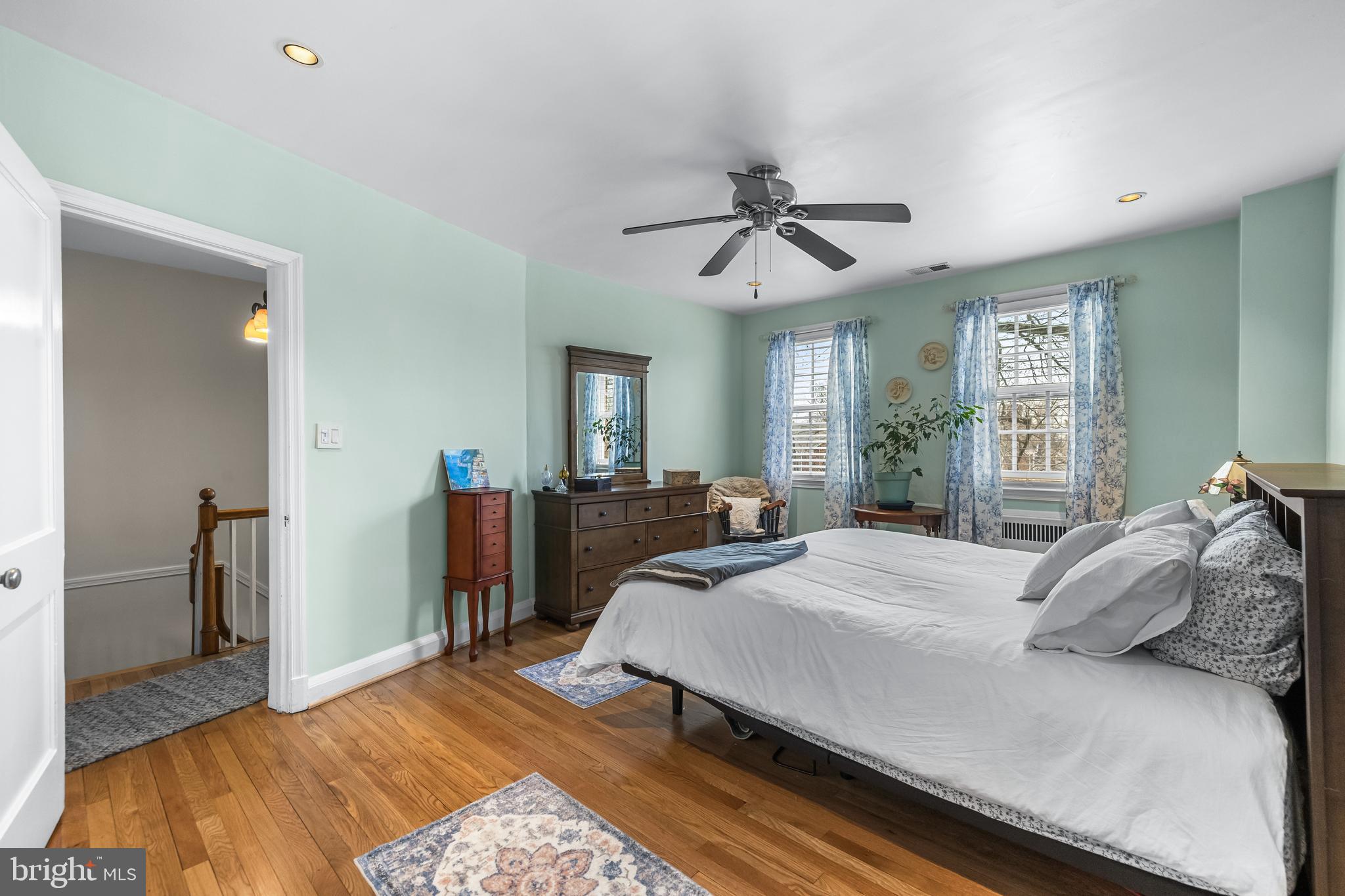 6447 Blenheim Road Baltimore, MD 21212 - Photo 28 of 51 a bedroom with a large bed a flat tv screen and dresser