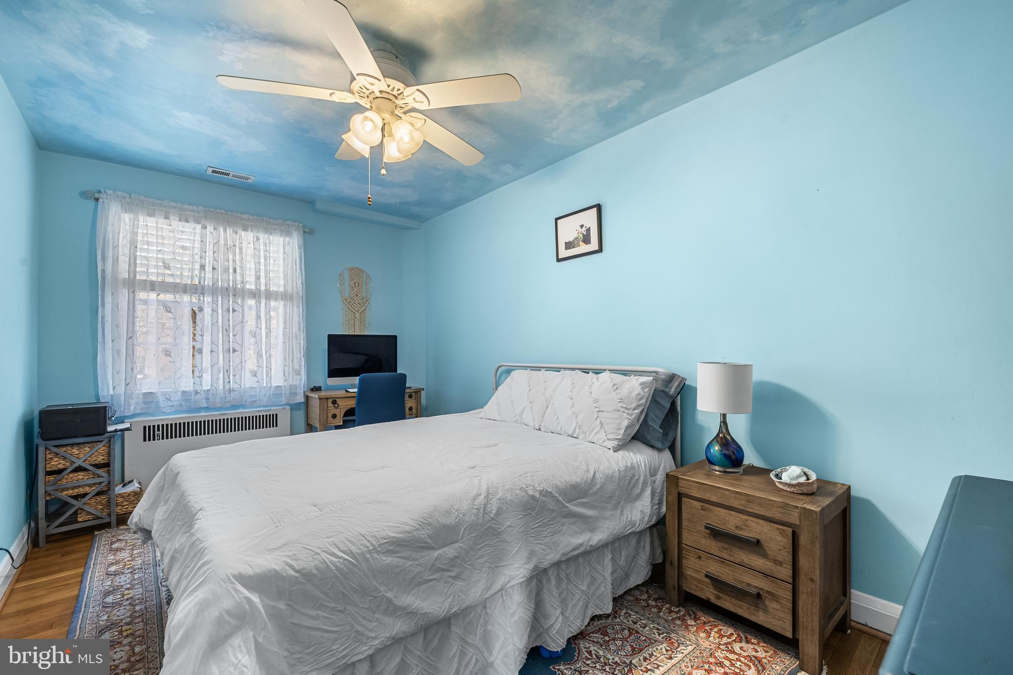 6447 Blenheim Road Baltimore, MD 21212 - Photo 31 of 51 a bedroom with a bed and a chandelier