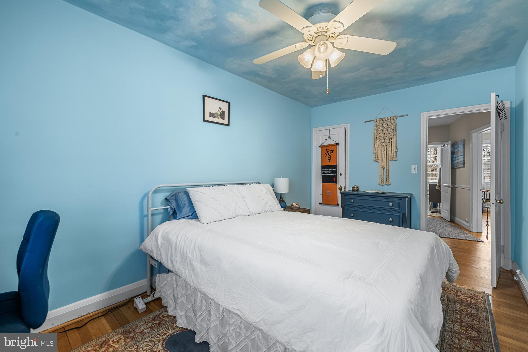 6447 Blenheim Road Baltimore, MD 21212 - Photo 33 of 51 a bedroom with a bed and a chandelier