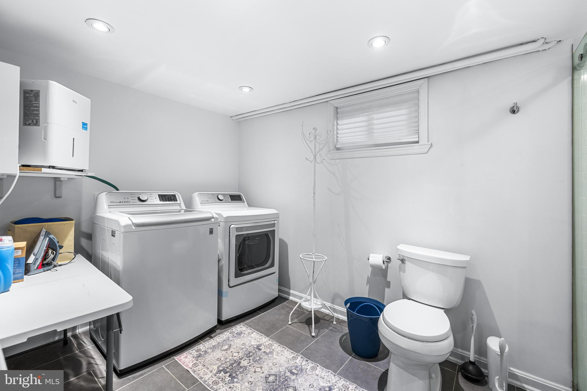 6447 Blenheim Road Baltimore, MD 21212 - Photo 39 of 51 a view of bathroom with a toilet sink and mirror