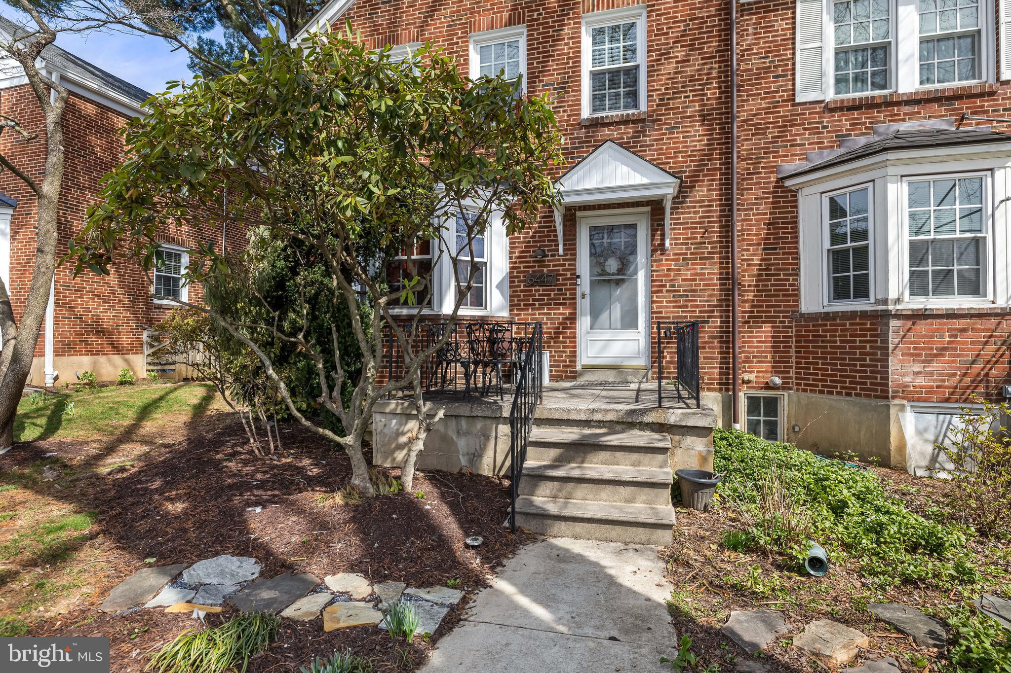 6447 Blenheim Road Baltimore, MD 21212 - Photo 4 of 51 a front view of a house with a garden