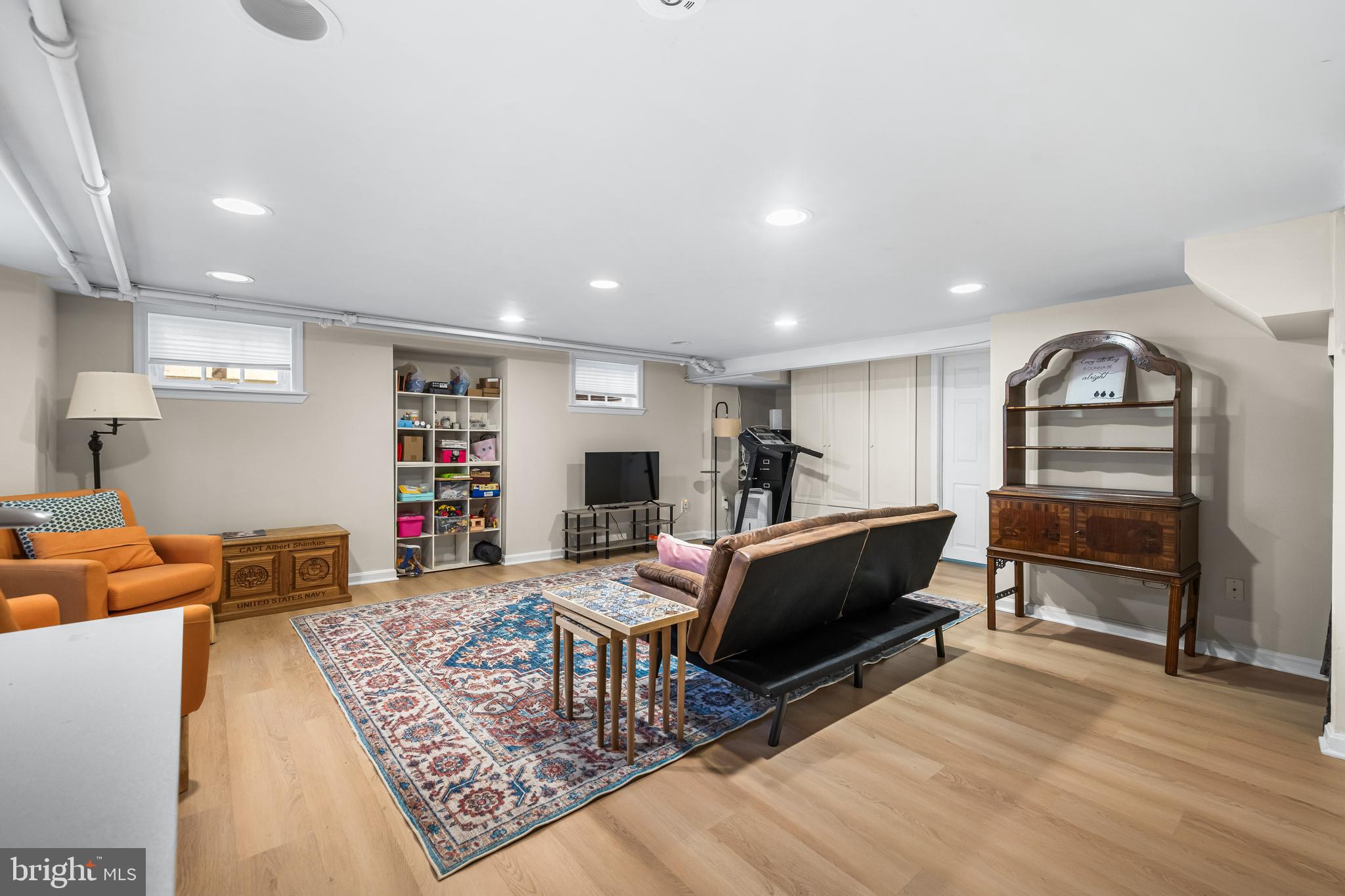 6447 Blenheim Road Baltimore, MD 21212 - Photo 42 of 51 a living room with furniture a wooden floor and a piano