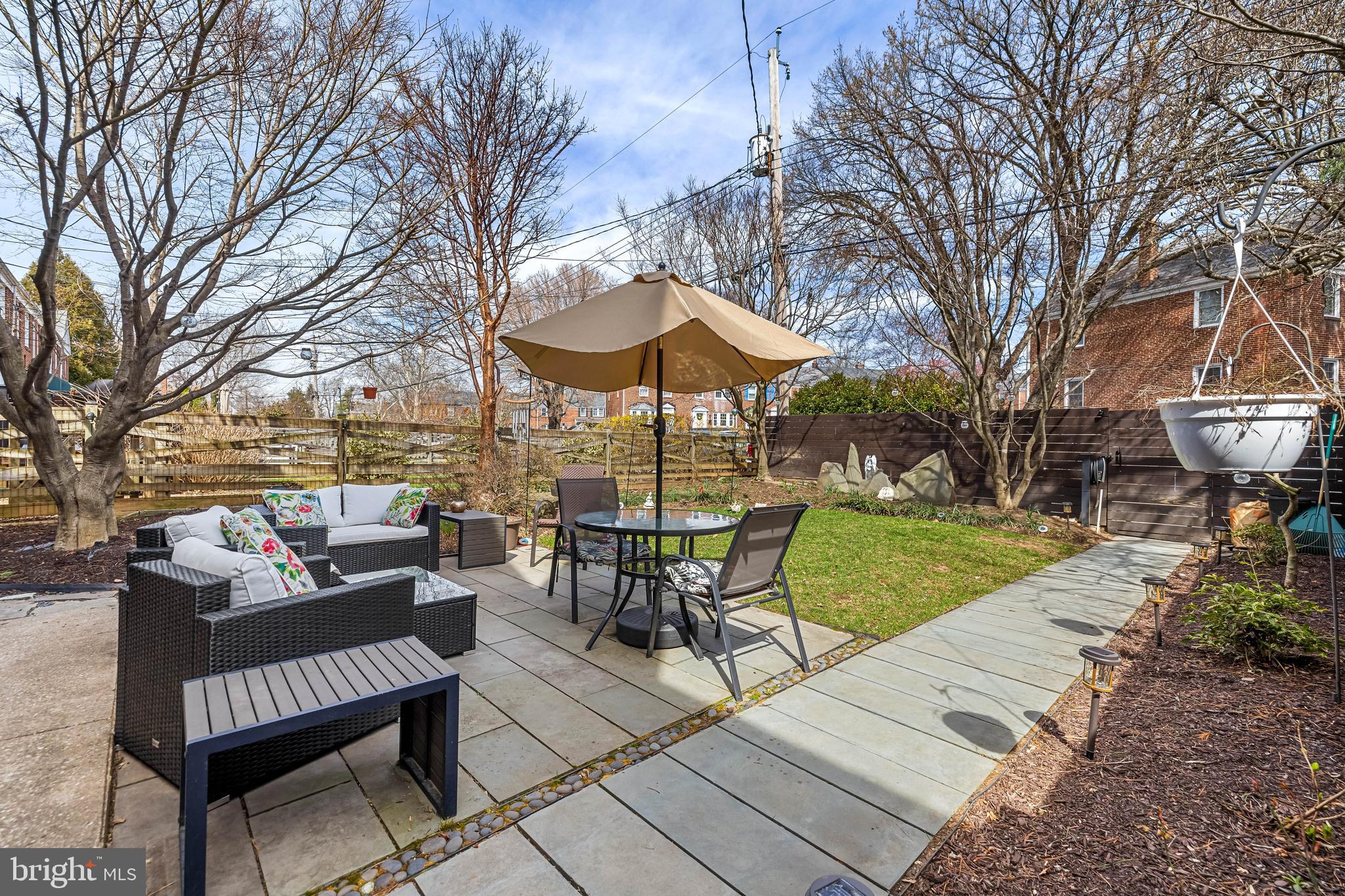 6447 Blenheim Road Baltimore, MD 21212 - Photo 45 of 51 a view of a patio with couches under an umbrella