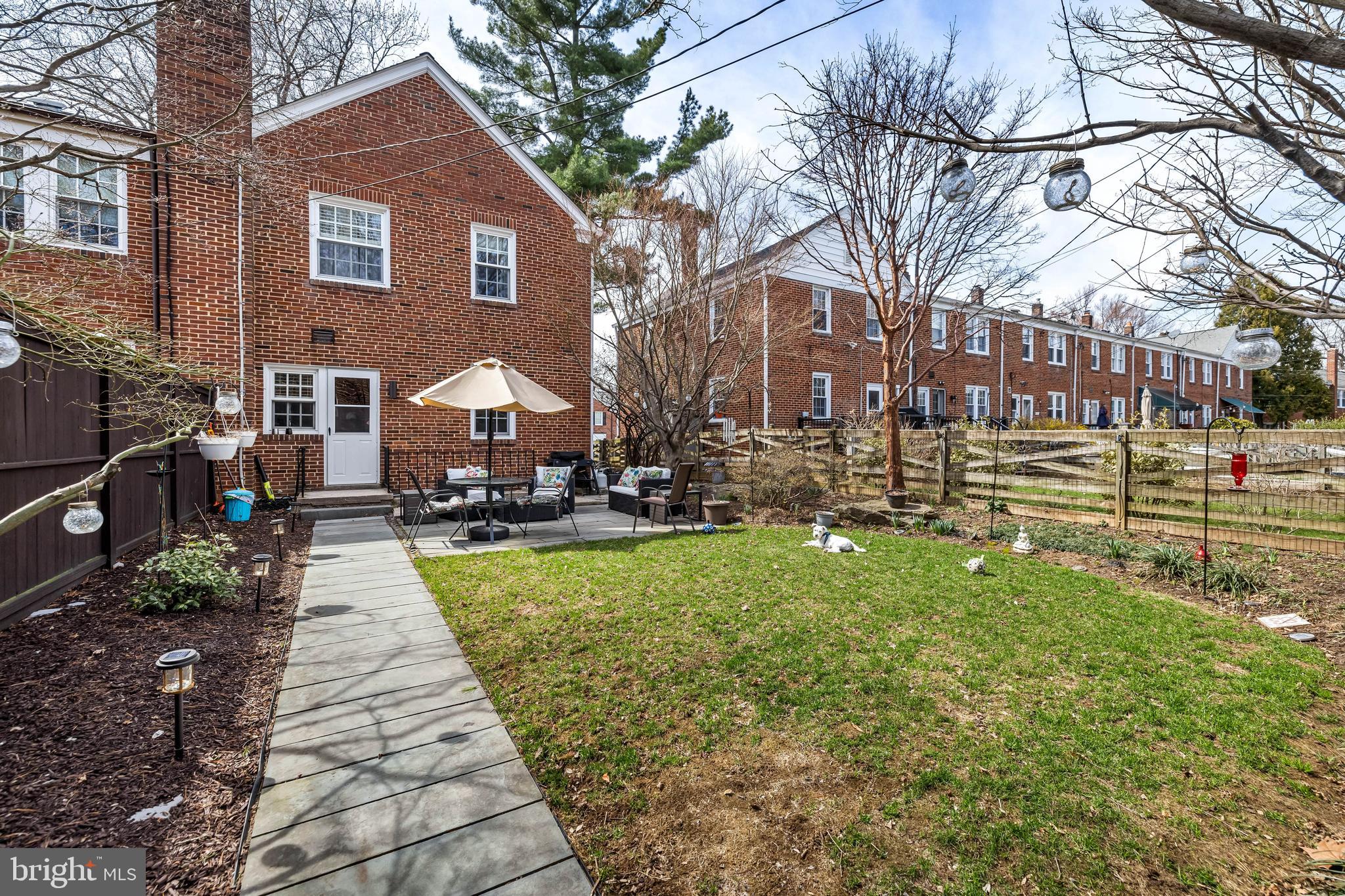 6447 Blenheim Road Baltimore, MD 21212 - Photo 47 of 51 a front view of a house with a yard