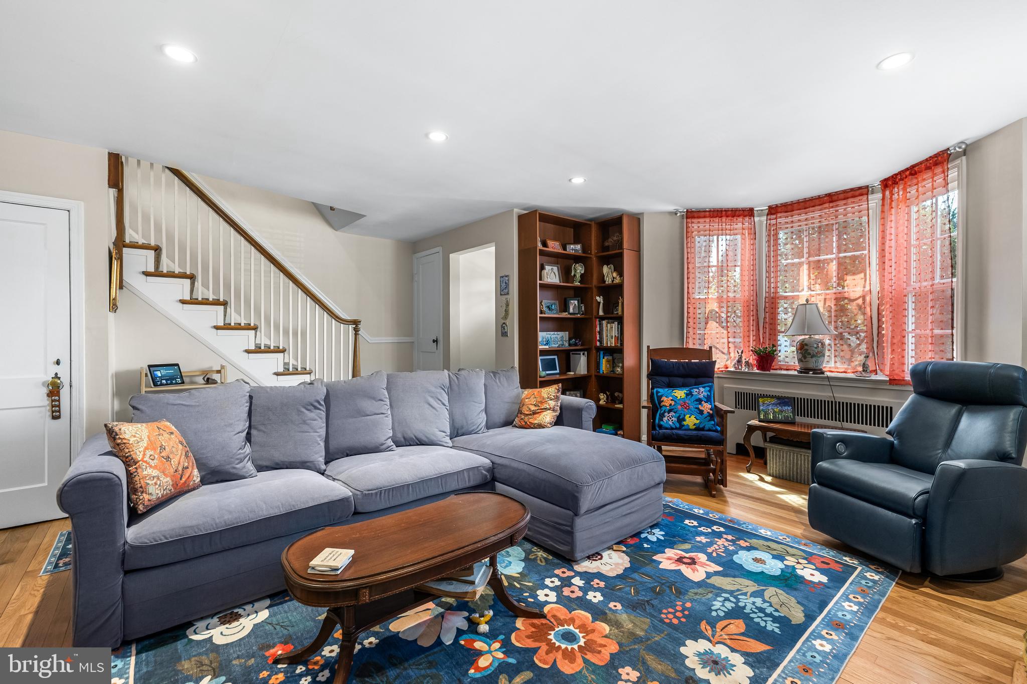 6447 Blenheim Road Baltimore, MD 21212 - Photo 8 of 51 a living room with furniture a rug and a large window