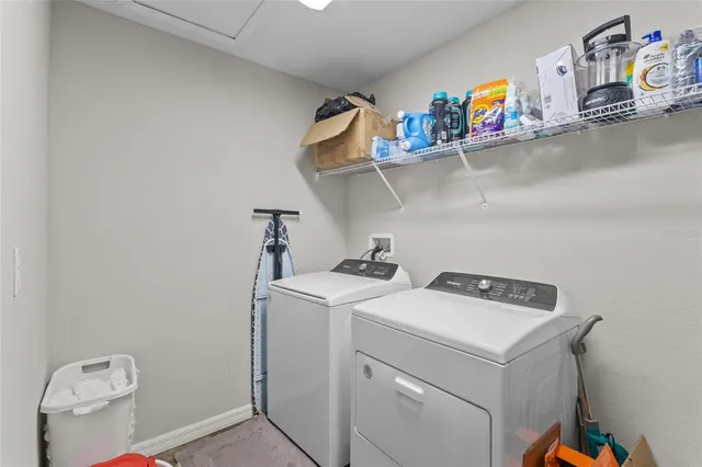 a view of a swimming pool with an outdoor seating and a yard