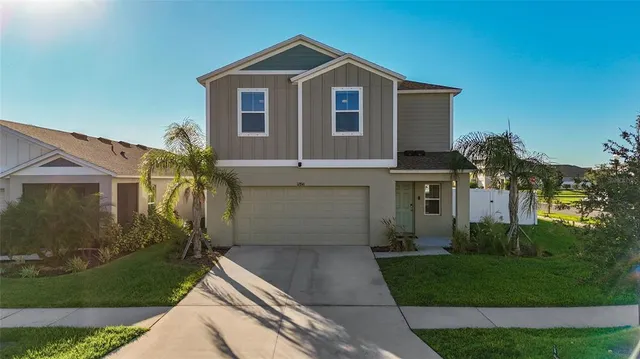 an aerial view of a house with a swimming pool