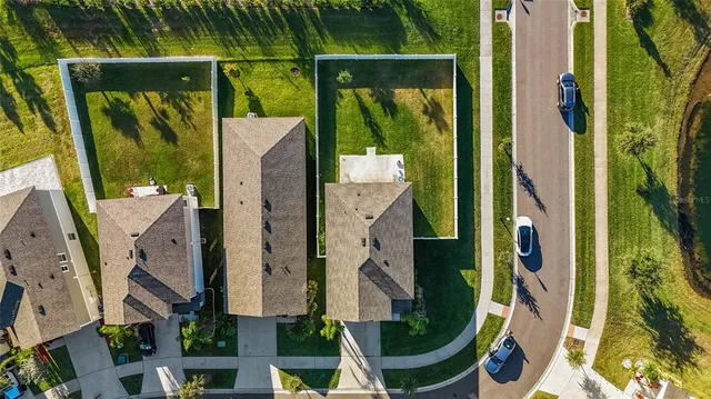 an aerial view of residential house with outdoor space and swimming pool