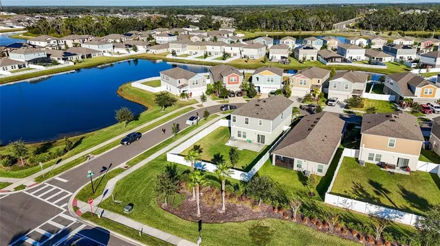 an aerial view of a house with a ocean view