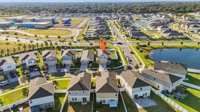 an aerial view of residential building and car parked