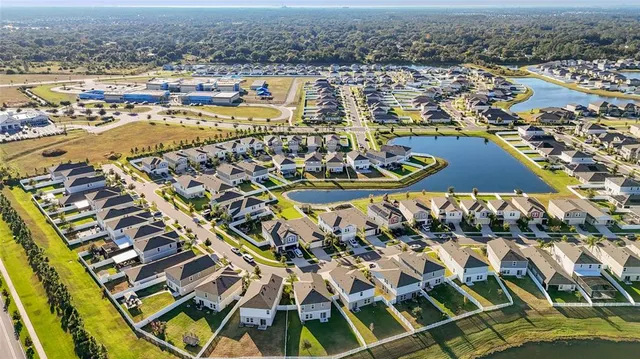 an aerial view of residential building and ocean view