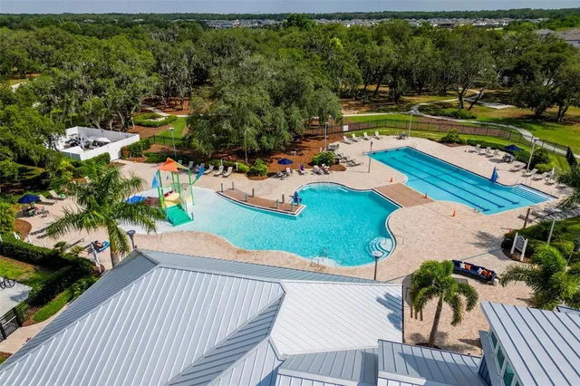 an aerial view of a house with outdoor space