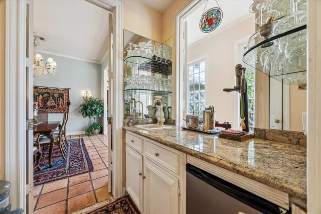 a kitchen with sink stove and cabinets