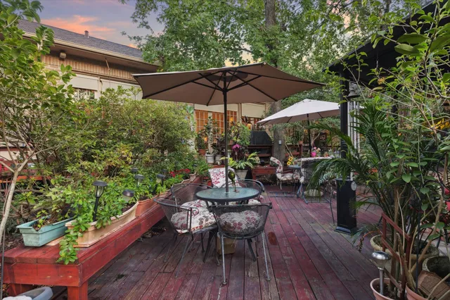 a view of a chairs and table in the patio