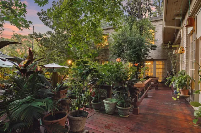 a view of a lake with a bench and trees