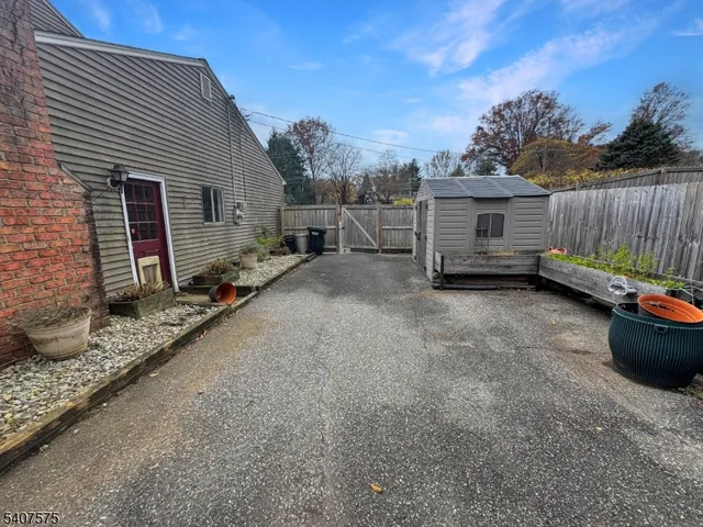 a view of a backyard with sitting area