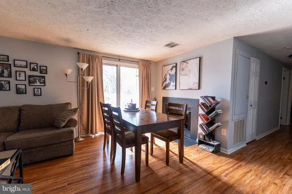 a view of a livingroom with furniture and a window