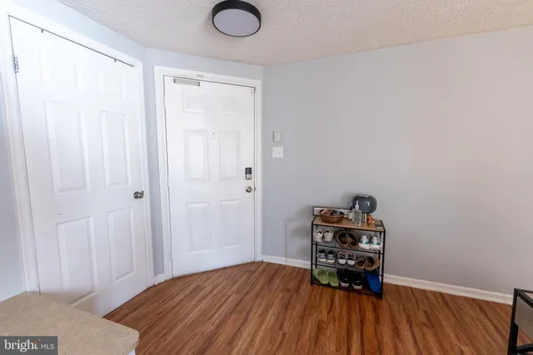 a bed room with a bed and a dresser