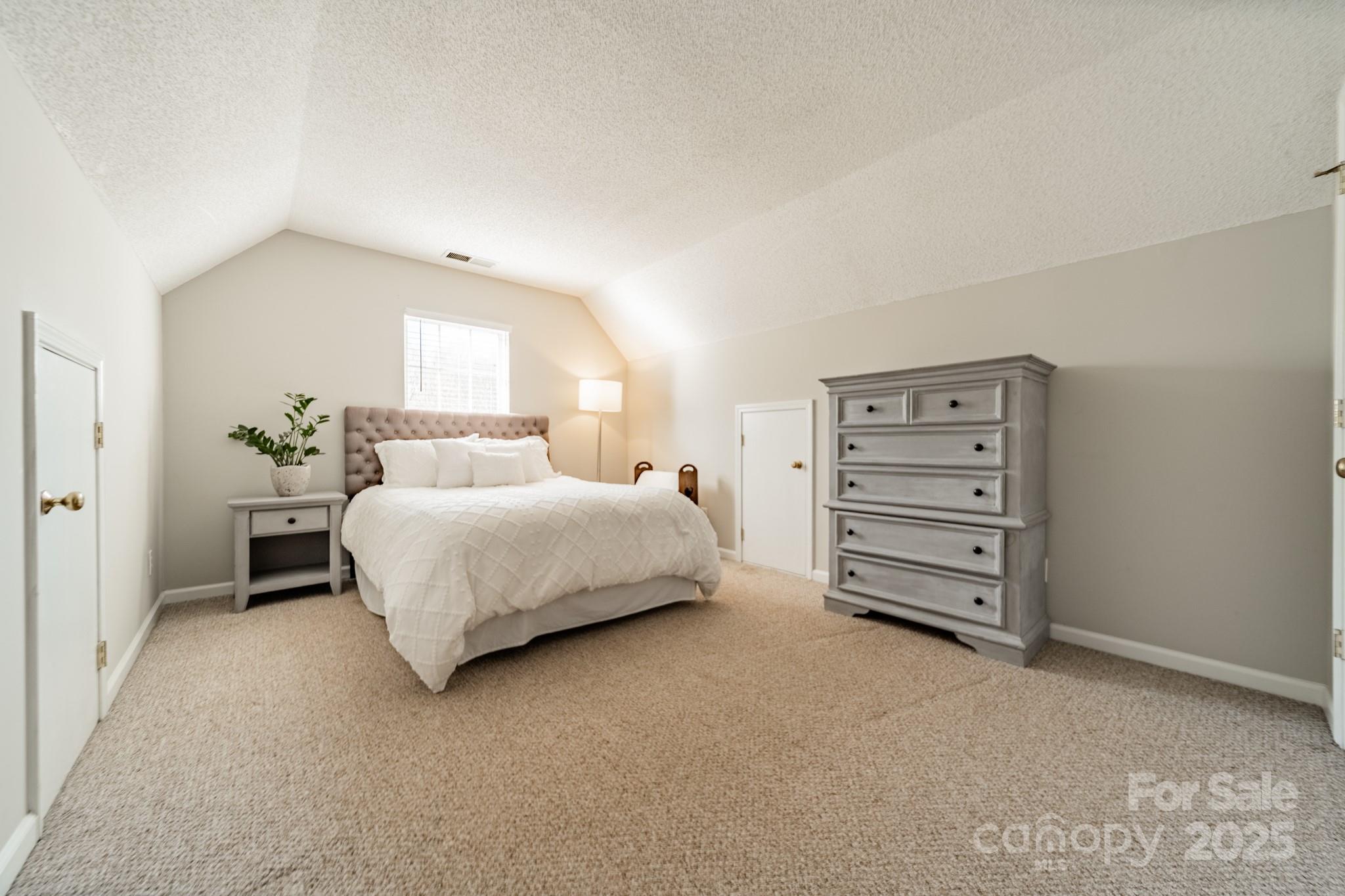 16104 Hollingbourne Road Huntersville, NC 28078 - Photo 21 of 40 a bedroom with a bed and a window