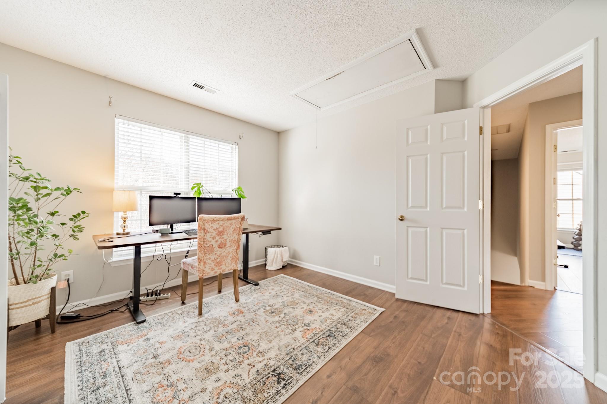 16104 Hollingbourne Road Huntersville, NC 28078 - Photo 24 of 40 a work room with furniture and wooden floor