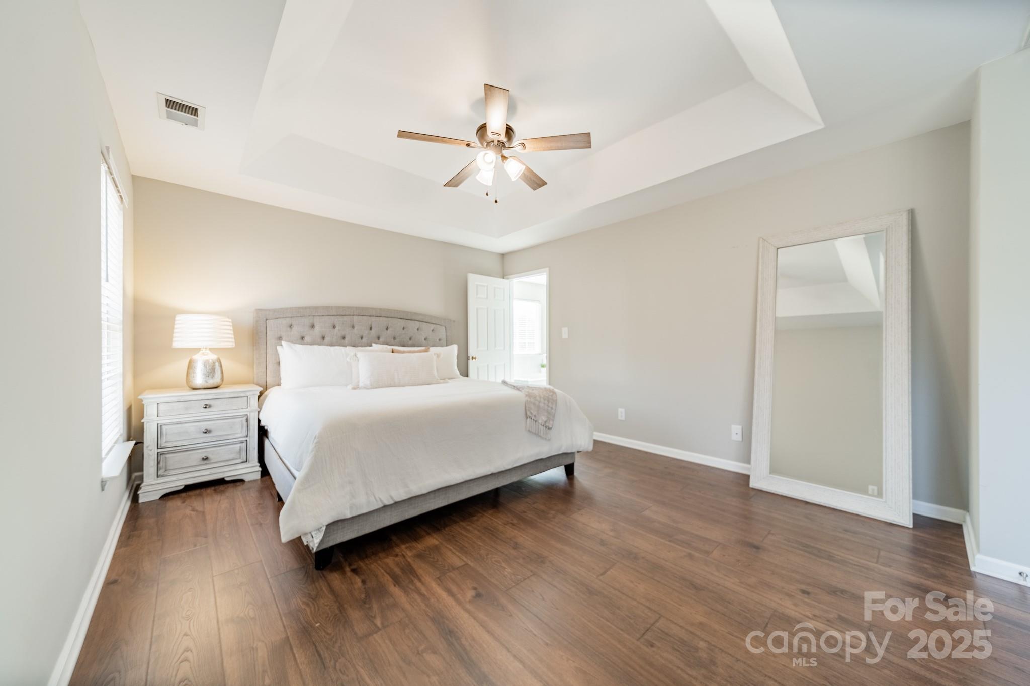 16104 Hollingbourne Road Huntersville, NC 28078 - Photo 27 of 40 a bedroom with a bed and wooden floor