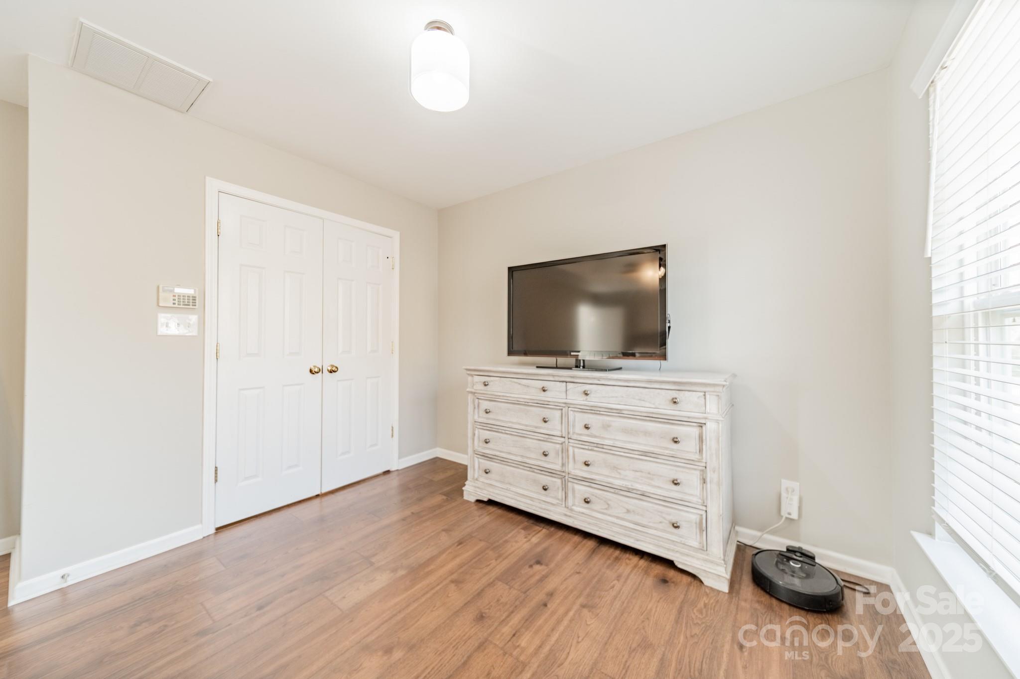 16104 Hollingbourne Road Huntersville, NC 28078 - Photo 28 of 40 a living room with furniture and flat screen tv