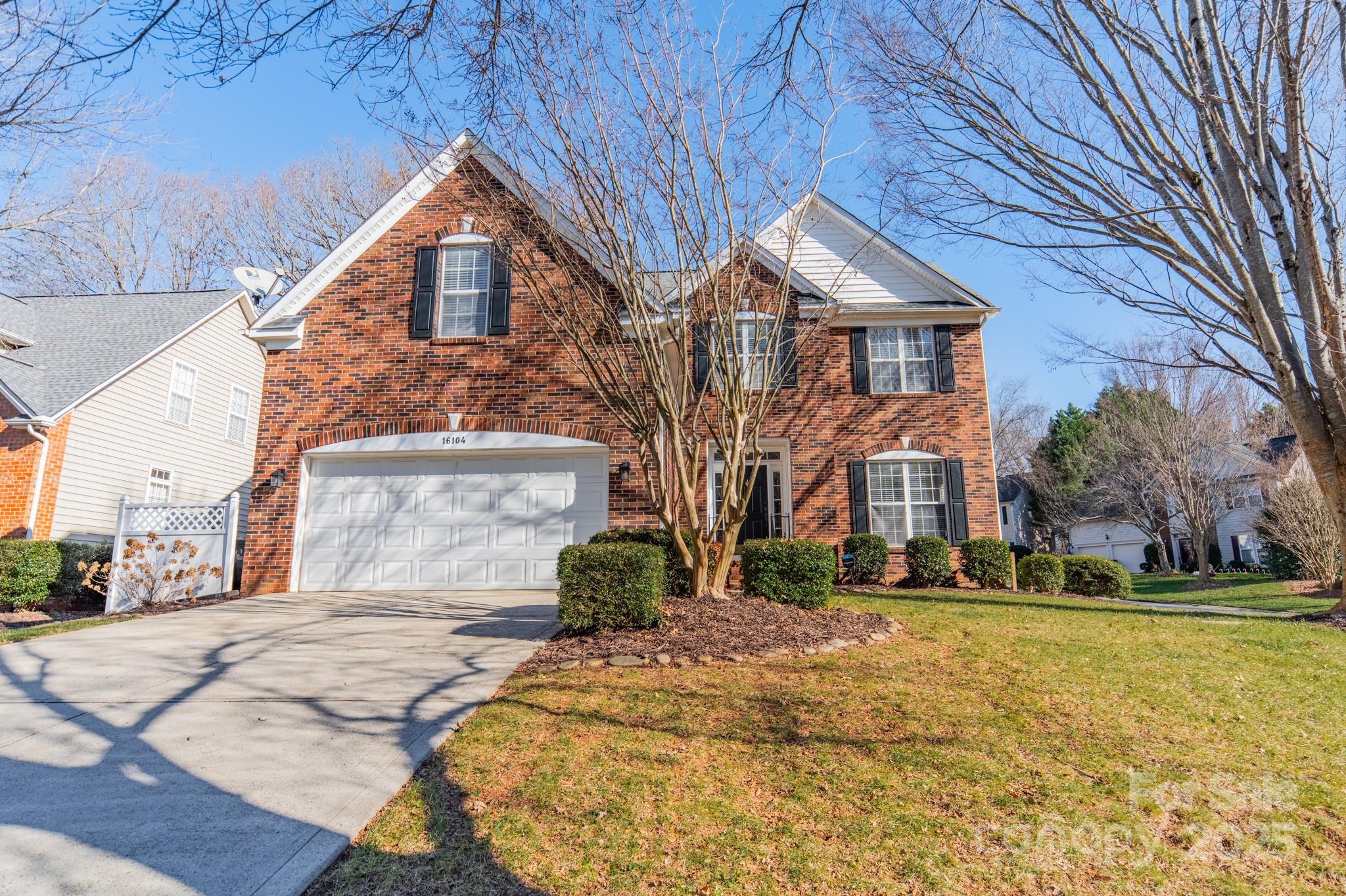 16104 Hollingbourne Road Huntersville, NC 28078 - Photo 3 of 40 a front view of a house with a yard