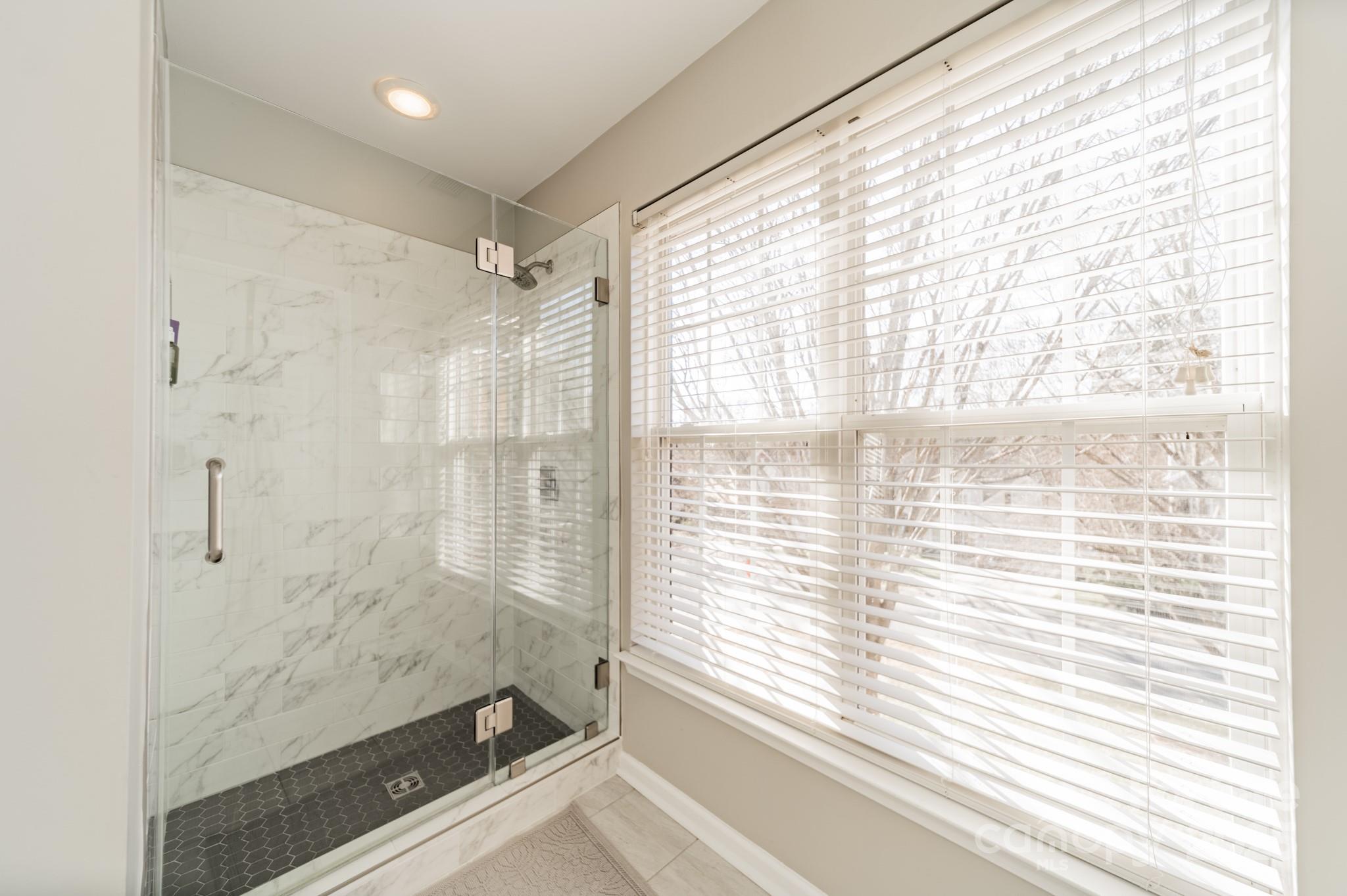16104 Hollingbourne Road Huntersville, NC 28078 - Photo 32 of 40 a bathroom with a shower and a bathtub