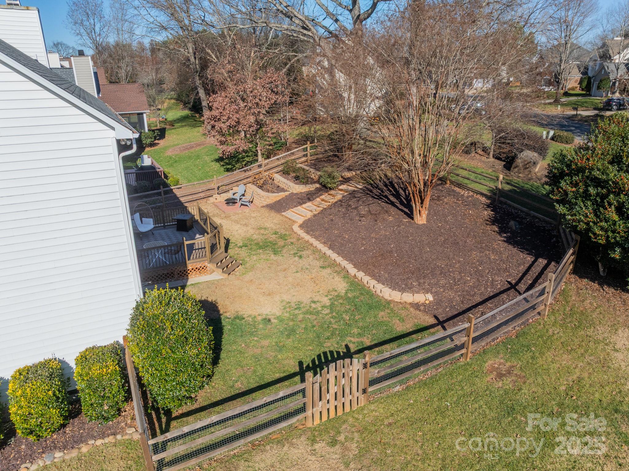 16104 Hollingbourne Road Huntersville, NC 28078 - Photo 36 of 40 a view of a backyard with plants