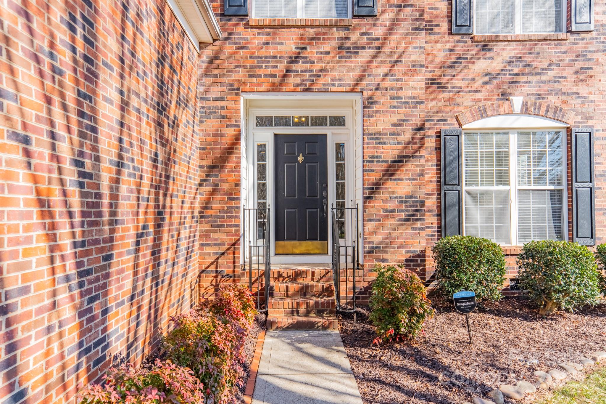 16104 Hollingbourne Road Huntersville, NC 28078 - Photo 4 of 40 a front view of a house with a yard