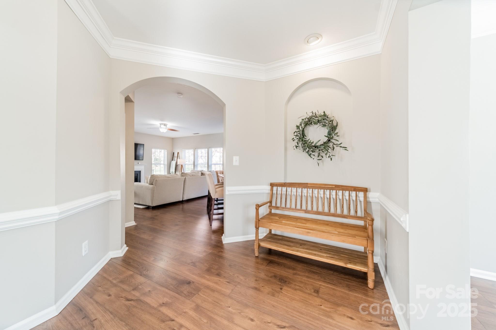 16104 Hollingbourne Road Huntersville, NC 28078 - Photo 5 of 40 a view of a room with wooden floor and a rug