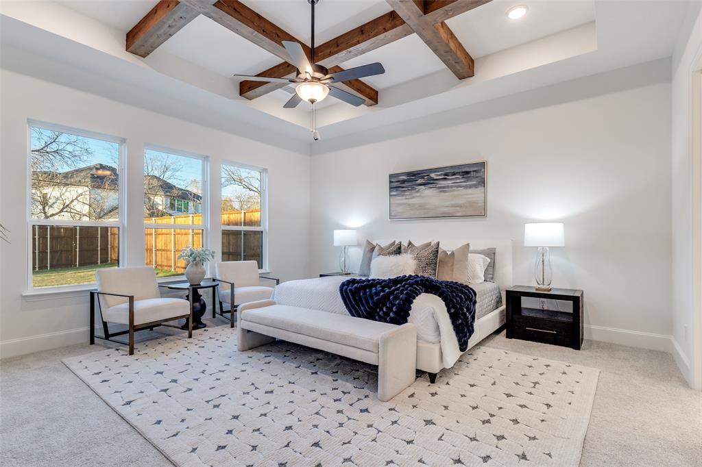 3849 Hawick Lane Dallas, TX 75220 - Photo 10 of 18 Luxe primary bedroom with coffered ceiling, light carpet, and beamed ceiling.