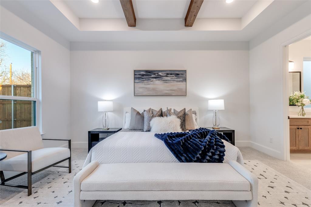 3849 Hawick Lane Dallas, TX 75220 - Photo 11 of 18 Luxe primary bedroom with coffered ceiling, light carpet, and beamed ceiling.