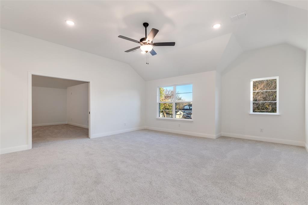 3849 Hawick Lane Dallas, TX 75220 - Photo 14 of 18 Bonus room with a vaulted ceiling, light colored carpet, and recessed lighting