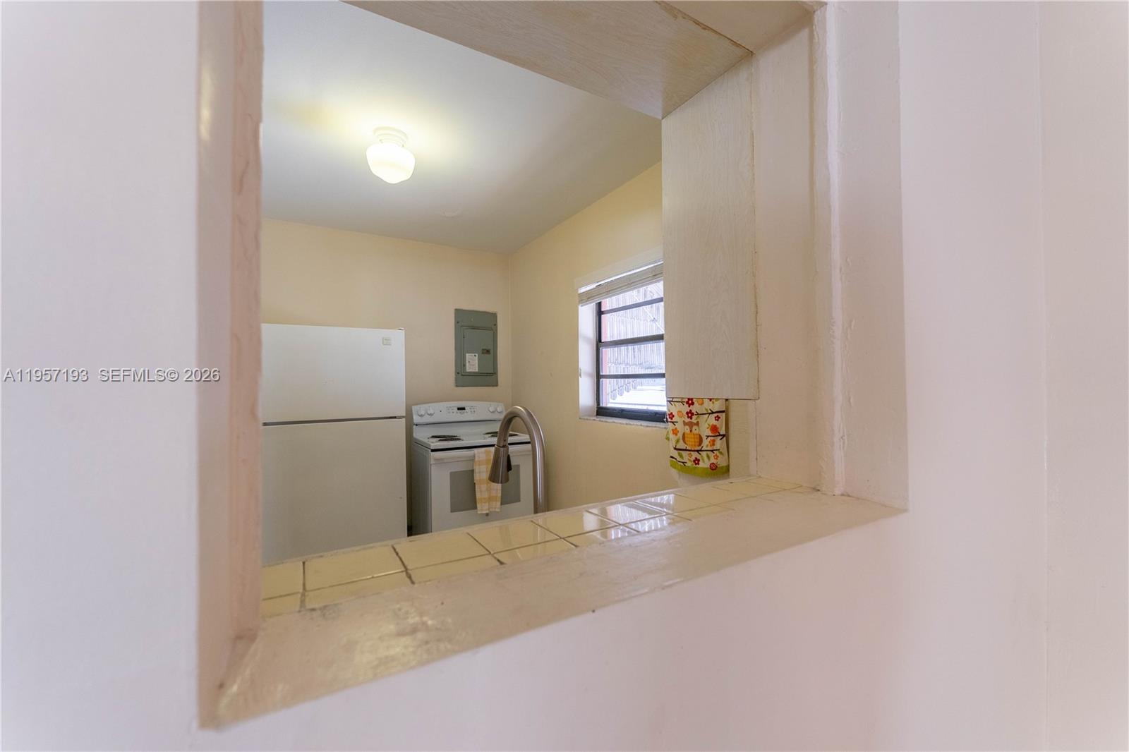 4381 Southwest 5th Terrace Miami, FL 33134 - Photo 11 of 34 a view of a kitchen with furniture and a window