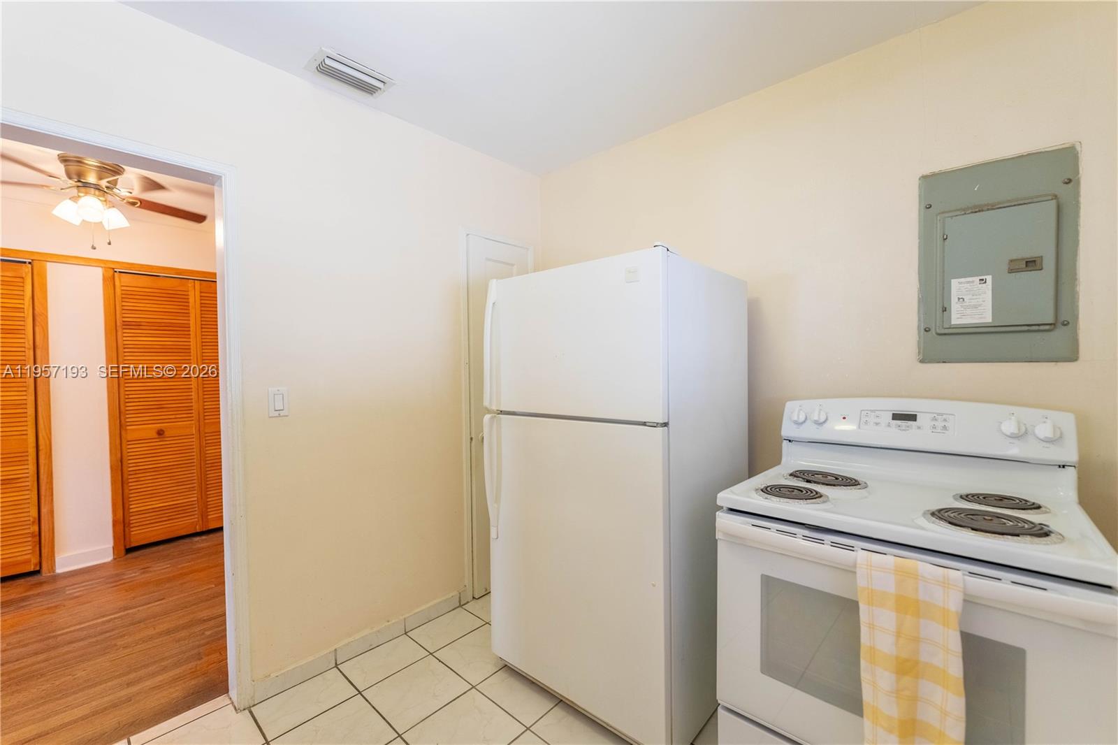 4381 Southwest 5th Terrace Miami, FL 33134 - Photo 13 of 34 a white refrigerator freezer and a stove sitting inside of a kitchen